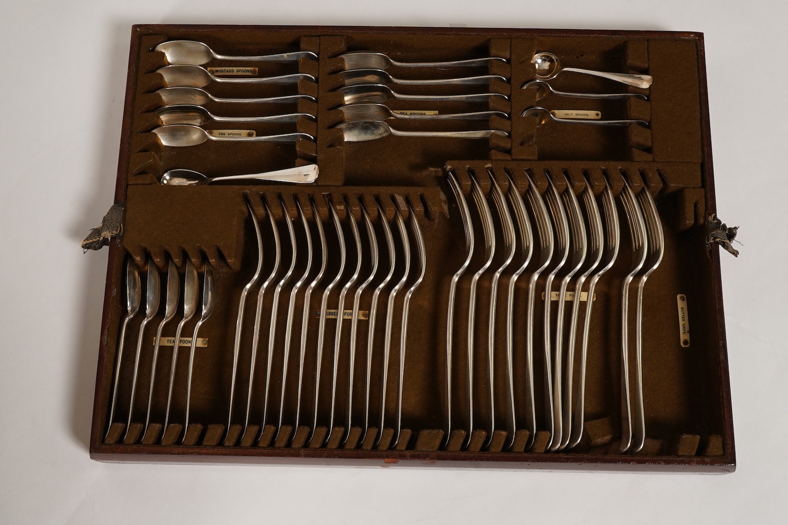 A George V canteen of silver Hanoverian rat tail flatware, by Mappin & Webb